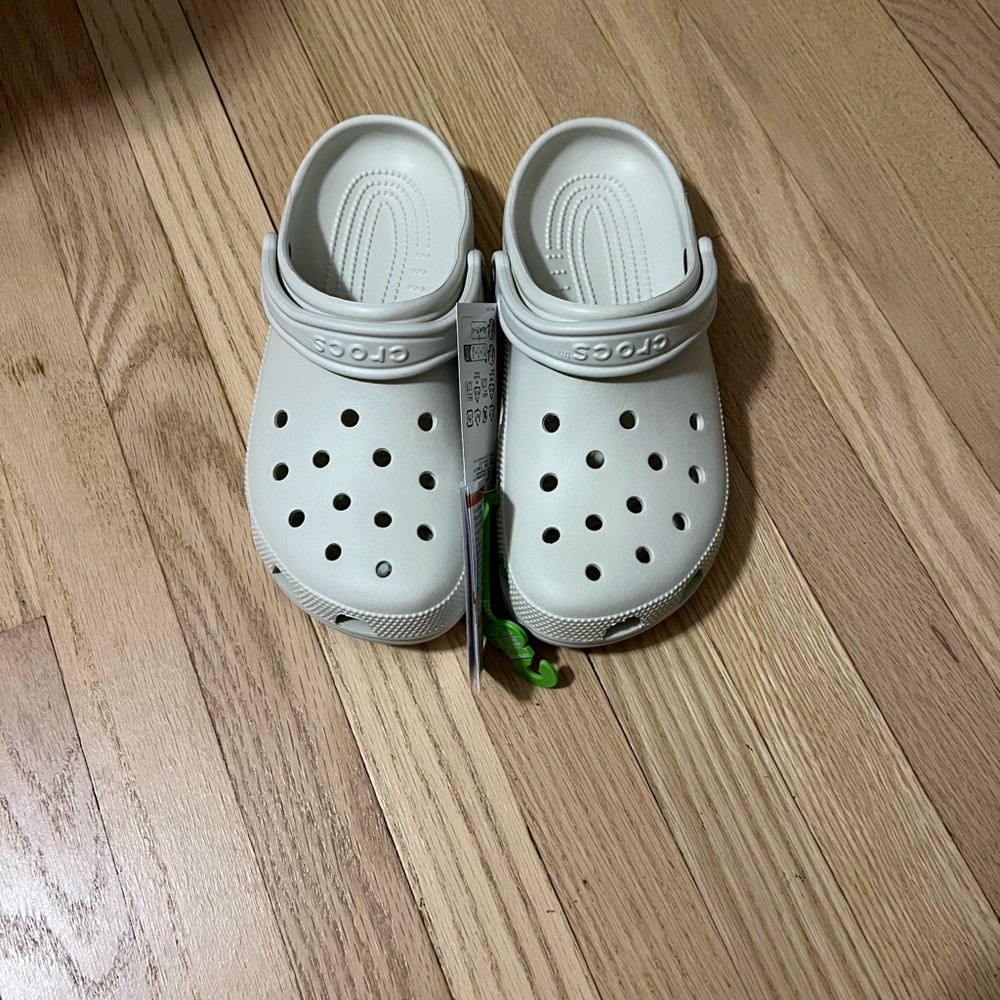 ADULTS' CROCS CLASSIC CLOGS
Crocs
- Cream.Size 8 men’s and 10 women’s